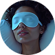 Relaxed woman wearing sleep mask on pillow
